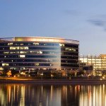 City over the water view at night | Farrmont Realty Group